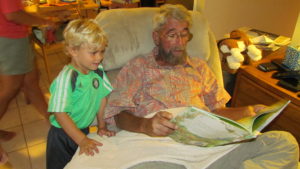 02-ollie-shares-his-new-book-with-granddad